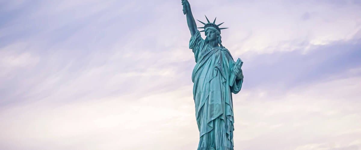 Researcher presenting at a whiteboard in a warm-lit university room